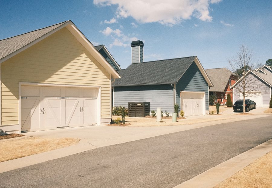 Two driveway aprons meeting the street edge side by side
